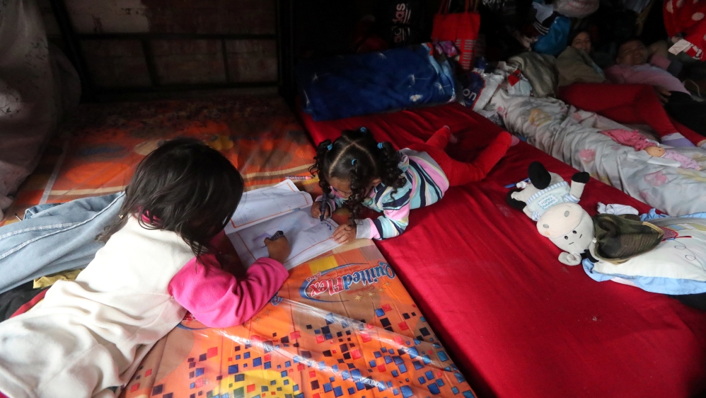 Venezuelan migrant children draw at a temporary shelter in the San Juan de Lurigancho district of Lima, Peru [Guadalupe Pardo/Reuters]