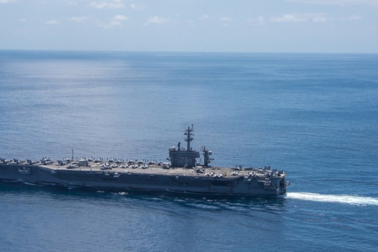 The aircraft carrier USS Carl Vinson transits the Indian Ocean