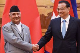 Nepal''s Prime Minister K.P. Sharma Oli shakes hand with Chinese Premier Li Keqiang