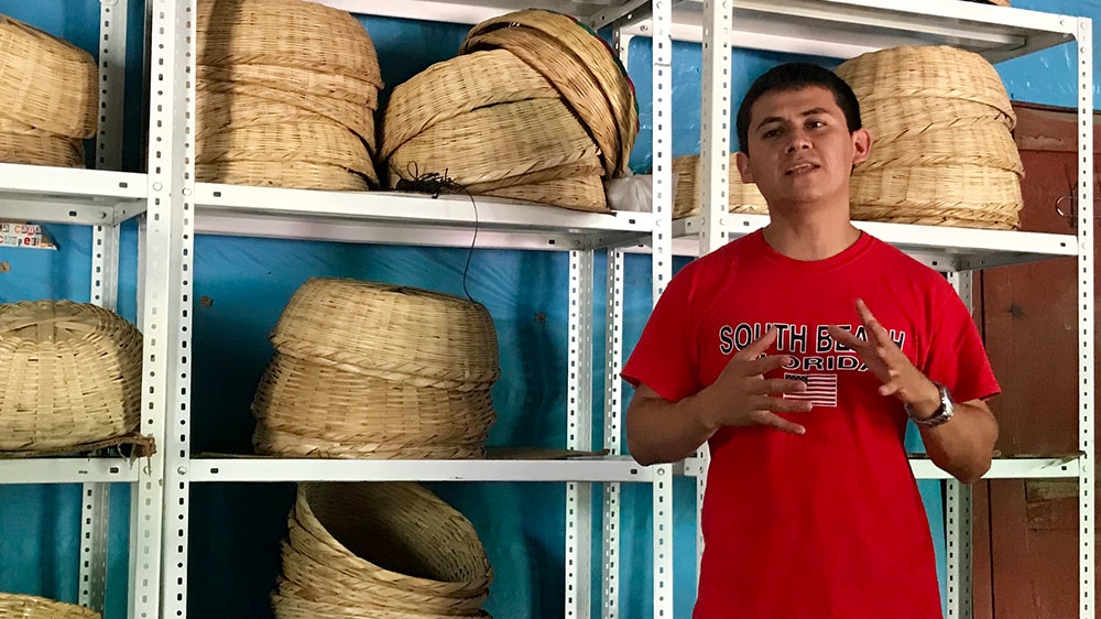 Canasta Campesina President Ever Valles, 26, discusses the organic agriculture cooperative that sells produce grown by small farmers directly to consumers in the capital [Heather Gies/Al Jazeera] 