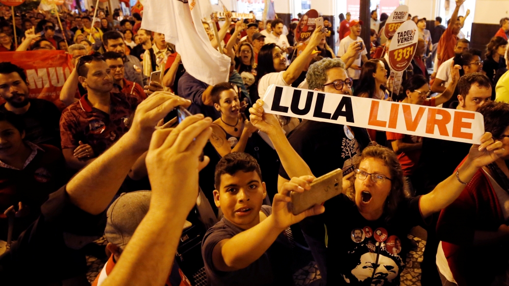 'Free Lula' posters at a rally of his supporters in Brazil [Rodolfo Buhrer/Reuters]
