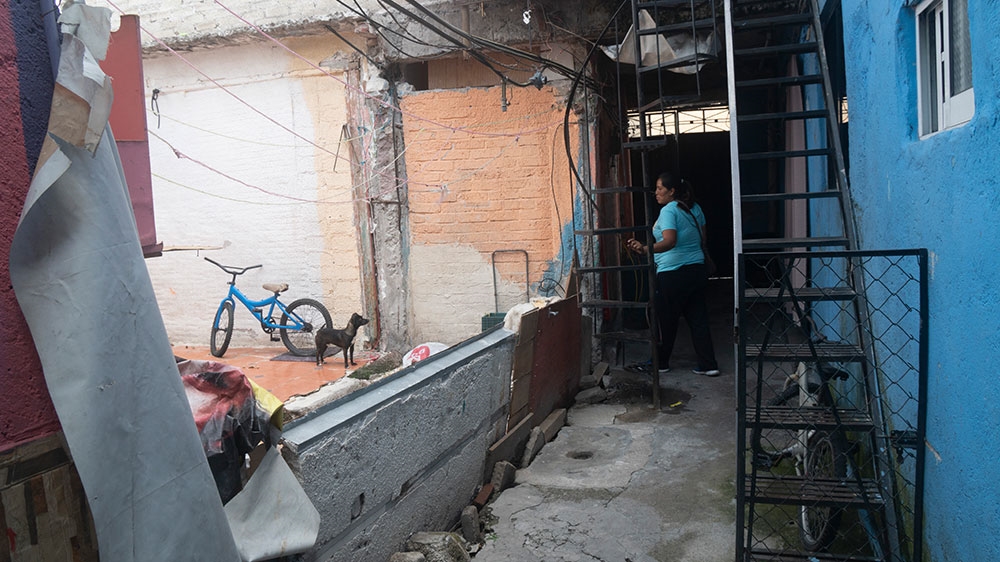 Romero's home collapsed after a February earthquake hit her severely damaged home [Lucina Melesio Friedman/Al Jazeera]