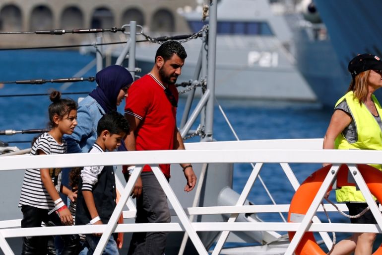 Migrants arrive on a patrol boat after being transferred from the rescue ship Aquarius, at the Armed Forces of Malta maritime squadron base at Haywharf in Valletta''s Marsamxett Harbour