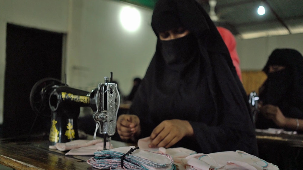 On average, the women produce 6,000 sanitary napkins and 3,000 panties a month [Sorin Furcoi/Al Jazeera]