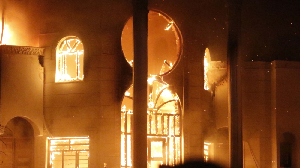 The Iranian consulate was reportedly empty when it was torched [Haider Mohammed Ali/AFP]