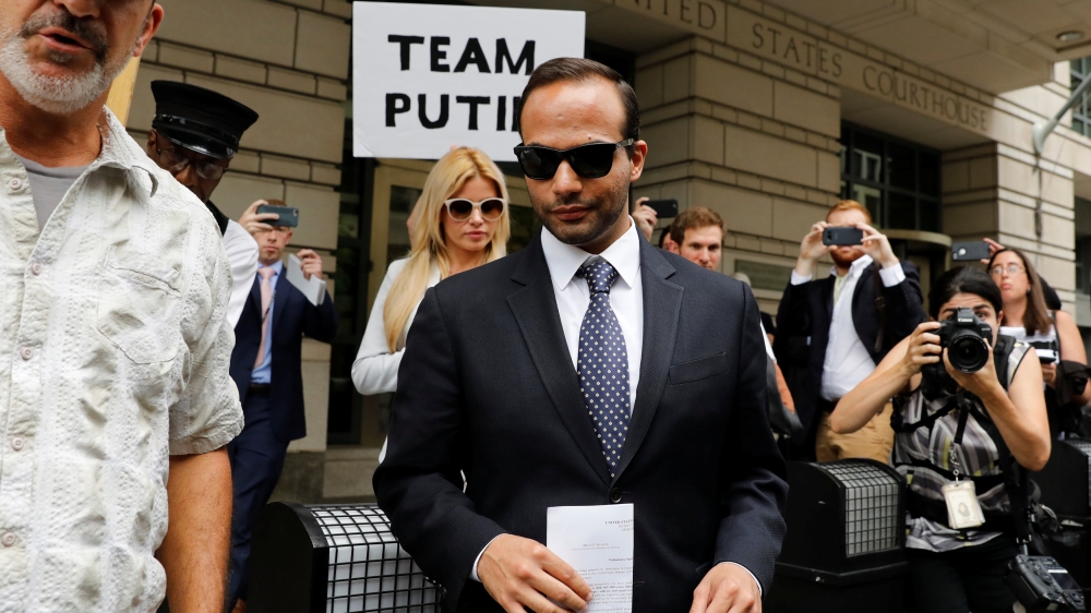Former Trump campaign aide George Papadopoulos with his wife Simona Mangiante seen leaving after his sentencing hearing at US District Court in Washington [File: Yuri Gripas/Reuters]