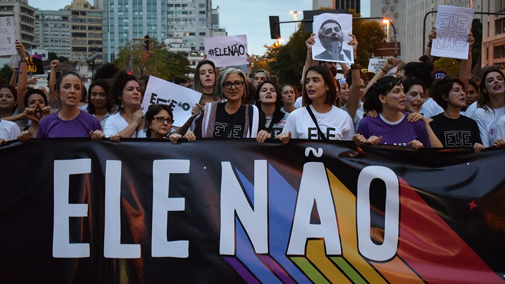 Tens of thousands of anti-Bolsonaro demonstrators gathered in central Rio [David Child/Al Jazeera]
