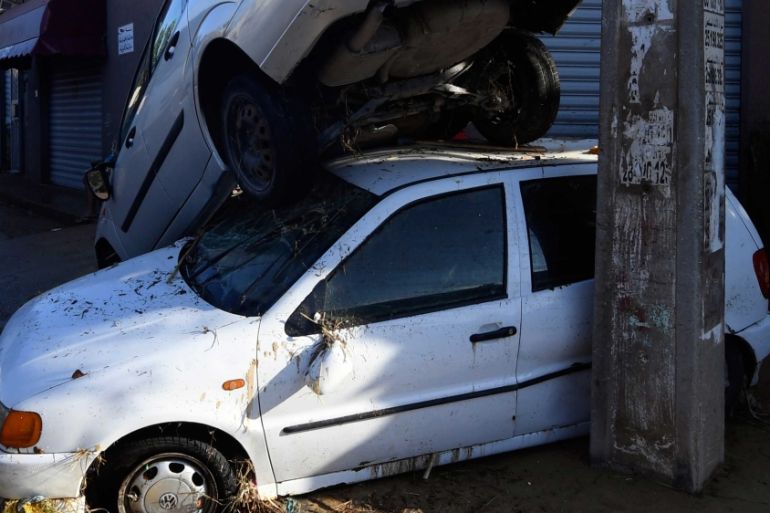Tunisian coastal governante of Nabeul shows cars piled upon each other after being swept away following deadly flash flooding in the town of Dar Chaabane.