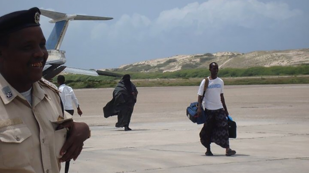 
Camera in hand, filmmaker Nasib Farah arrives in Mogadishu in 2010 to film Warriors from the North. It was his first trip back to the Somali capital since fleeing the civil war in 1991. [Nasib Farah]
