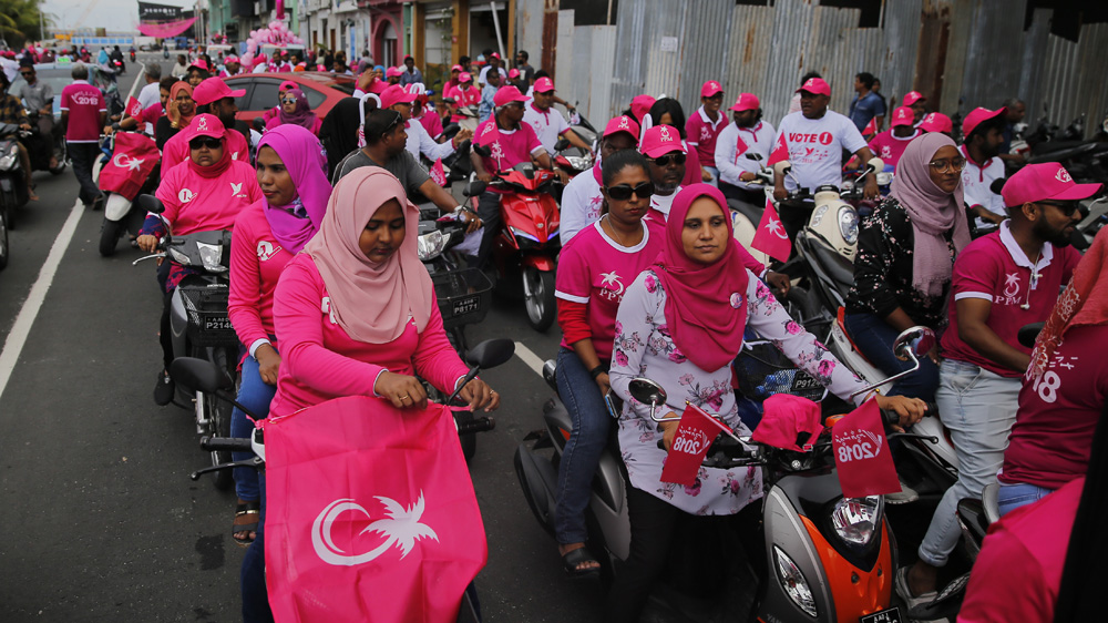 Supporters of President Yameen Abdul Gayoom participate in a street parade in Male on Saturday [Eranga Jayawardena/AP]