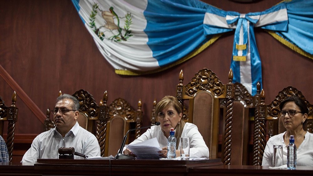 Dina Ochoa, president of the Constitutional Court, reads the unanimous decision to permit CICIG commissioner Ivan Velasquez to enter the country [Jeff Abbott/Al Jazeera] 