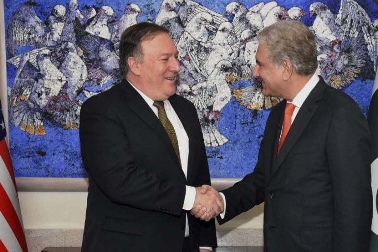 U.S. Secretary of State Mike Pompeo, left, shakes hand with Pakistan''s foreign minister Shah Mahmood Qureshi