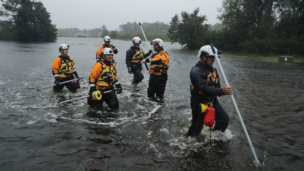 Rescuers search a flooded neighbourhood in Fairfield Habour, North Carolina for evacuees during Hurricane Florence [Chip Somodevilla/Getty Images/AFP]