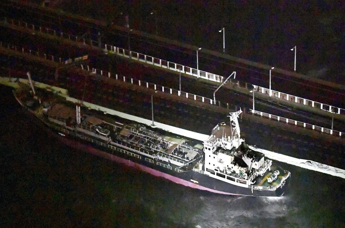A 2,591-tonne tanker, which is sent by strong wind caused by Typhoon Jebi, crashes into a bridge connecting Kansai airport, which is built on a man-made island in a bay, to the mainland, in Izumisano,
