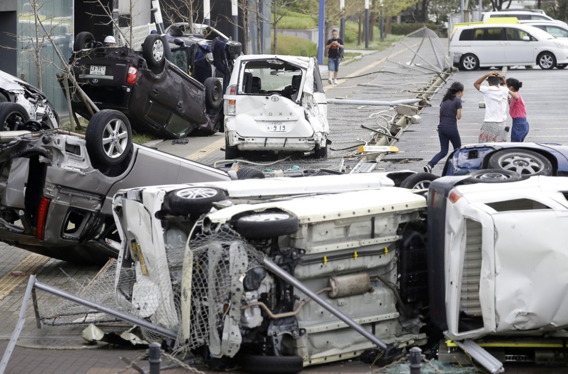 Vehicles damaged by Typhoon Jebi are seen in Osaka, western Japan,†in this photo taken by Kyodo September 4, 2018. Mandatory credit Kyodo/via REUTERS ATTENTION EDITORS - THIS IMAGE WAS PROVIDED BY A T