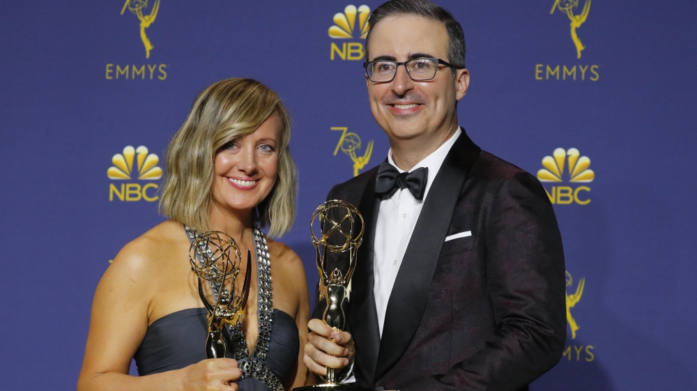  John Oliver poses backstage with Liz Stanton and the Outstanding Variety Talk Series award for Last Week Tonight with John Oliver [Mike Blake/Reuters]