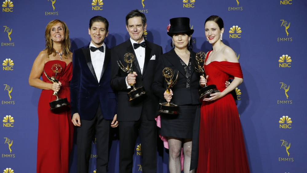 The cast poses backstage with their Outstanding Comedy Series award for The Marvelous Mrs Maisel [Mike Blake/Reuters]