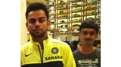 India's Virat Kohli with Munawar [The player depicted is not implicated in any wrongdoing/Al Jazeera]