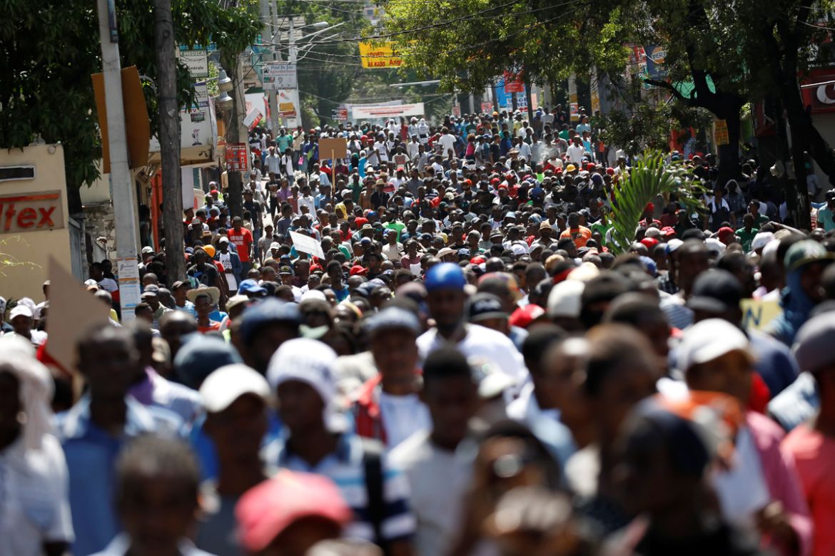 Protesters march to demand an investigation into what they say is the alleged misuse of Venezuela-sponsored PetroCaribe funds, in Port-au-Prince, Haiti, October 17, 2018. REUTERS/Andres Martinez Casar