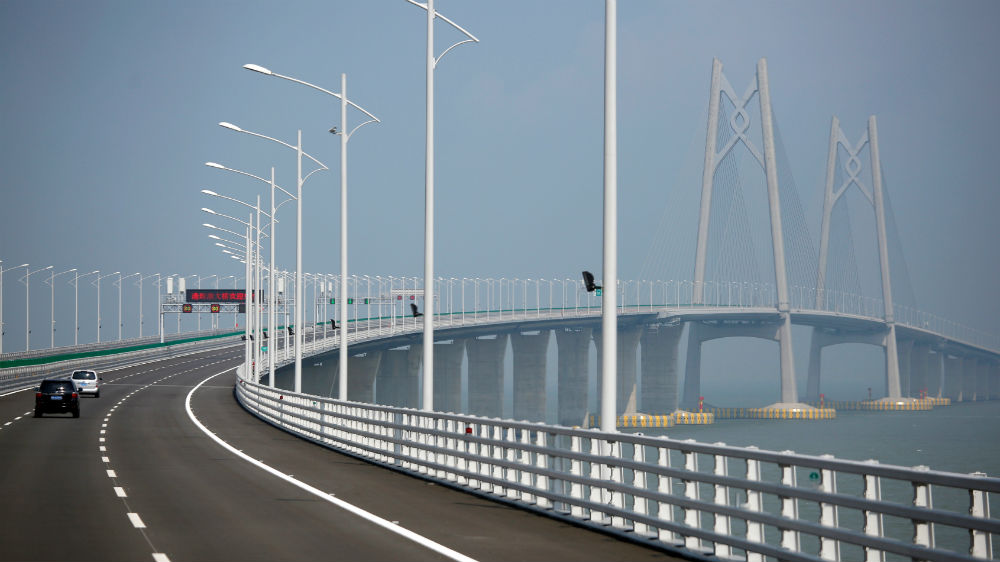 Cars on the Hong Kong-Zhuhai-Macau Bridge during its testing phase [Bobby Yip/Reuters]
