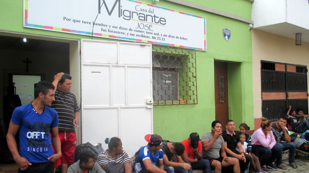 Hondurans rest outside Esquipulas shelter kitchen [Sandra Cuffe/Al Jazeera] 
