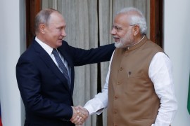 Russian President Vladimir Putin and India&#39;s Prime Minister Narendra Modi shake hands before a meeting in New Delhi, India, October 5, 2018 [Adnan Abidi/Reuters]