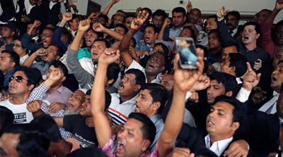 Zia's supporters have remained loyal through her legal troubles [Mohammad Ponir Hossain/Reuters]