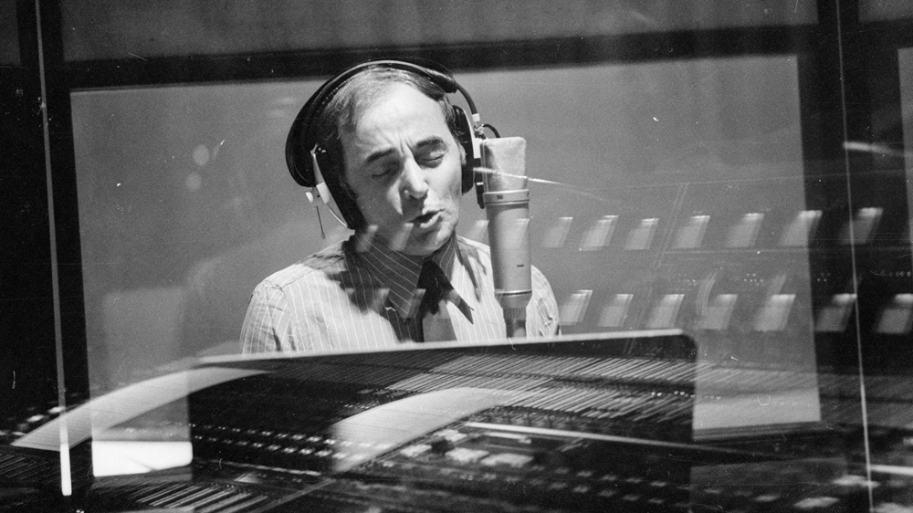 French singer Charles Aznavour in a recording studio in 1974 [File: Victor Blackman/Getty Images]