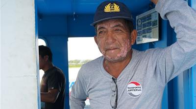 Gadiel Guedez, captain of the Eduardo II, has sailed the Amazon’s rivers for decades [Neil Giardino/Al Jazeera]