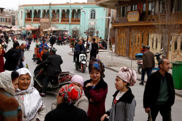 FILE PHOTO: People mingle in the old town of Kashgar