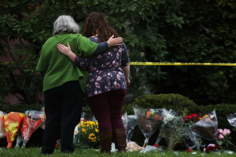 People visit an impromptu memorial at the Tree of Life synagogue following Saturday''s shooting at the synagogue in Pittsburgh Pennsylvania