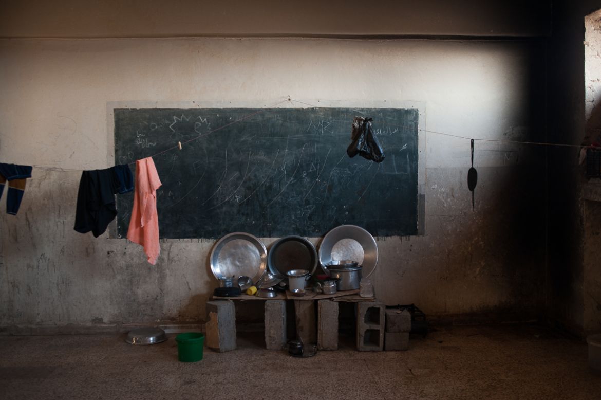 A classroom converted into an apartment in the abandoned school of Harijieh. The diet of IDPs is mainly based on bread and tea. September 2018