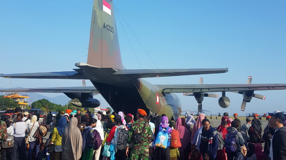 About 300 victims attempted to board Indonesian military transport planes to be evacuated [Ted Regencia/Al Jazeera]
