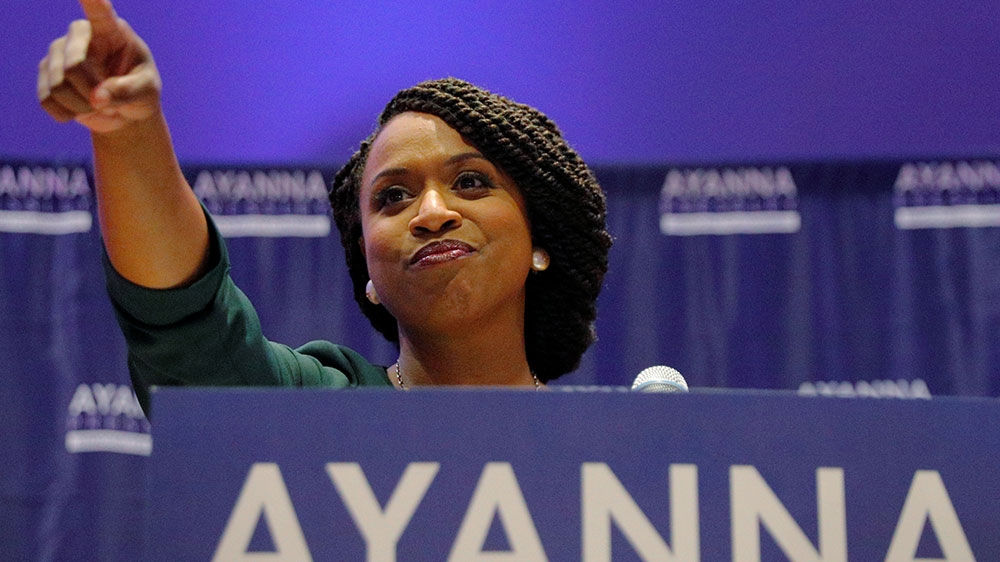 Democratic candidate for US House of Representatives Ayanna Pressley points to her supporters after winning the Democratic primary in Massachusetts [Brian Snyder/Reuters]