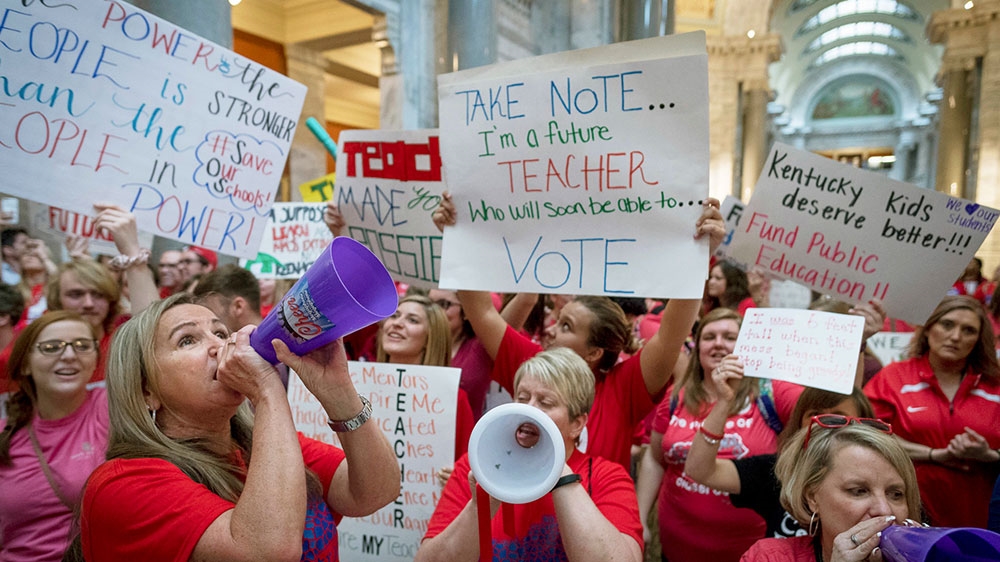 Teachers from across Kentucky gathered inside the state Capitol building in Frankfort to rally for increased funding for education [Bryan Woolston/AP Photo] 