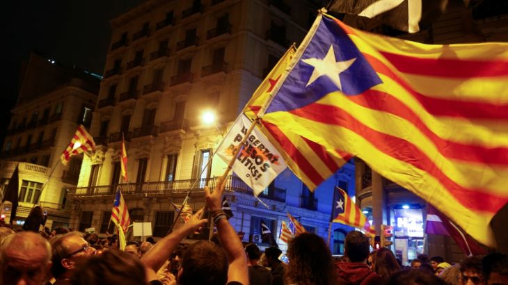 Protestors wave Catalan separatist flags following a demonstration on the first anniversary of Catalonia''s banned October 1, 2017 independence referendum in Barcelona