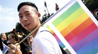 Pro-LGBT marchers took to the streets in October before the referendum [Chiang Ying-ying/AP Photo]