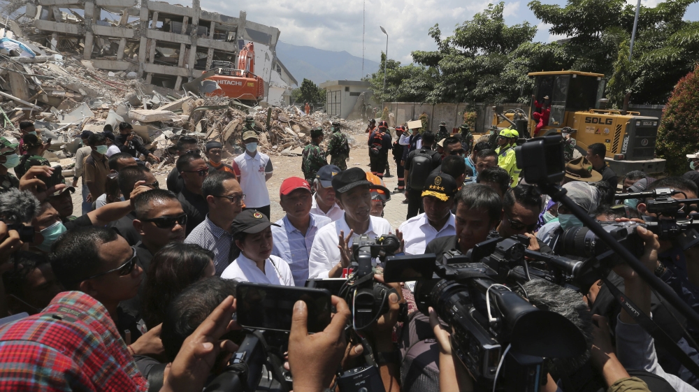 Joko Widodo made his second visit to the disaster zone on Wednesday [Tatan Syuflana/AP]