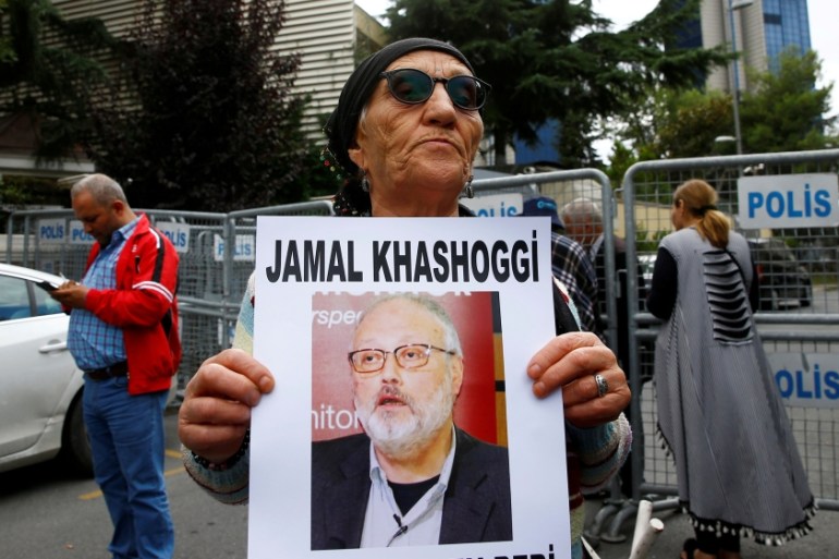 A human rights activist holds picture of Saudi journalist Jamal Khashoggi during a protest outside the Saudi Consulate in Istanbul