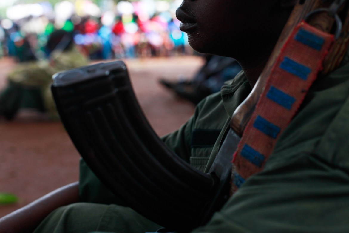 A child former child soldier is waiting in line during a child soldiers release ceremony, outside Yambio, in South Sudan, on August 7th, 2018.