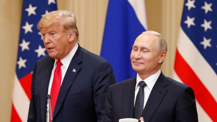 U.S. President Donald Trump and Russian President Vladimir Putin arrive for a joint news conference after their meeting in Helsinki, July 16, 2018. [Grigory Dukor/Reuters]
