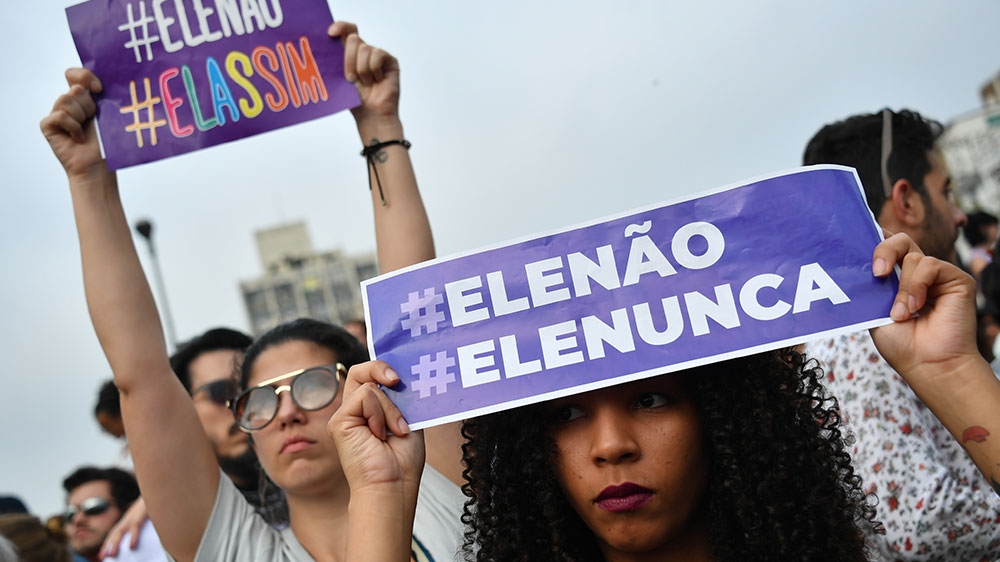 Demonstrators take part in a protest against Brazilian right-wing presidential candidate Jair Bolsonaro [File: Nelson Almeida/AFP] 
