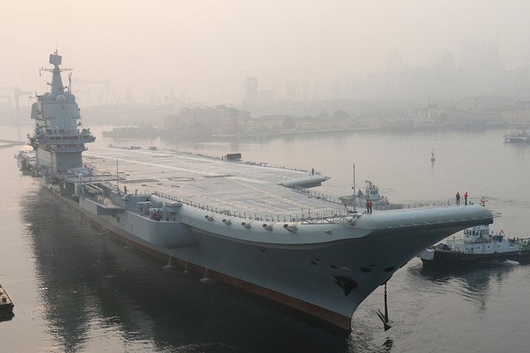 In this photo provided by China''s Xinhua News Agency, China''s aircraft carrier leaves Dalian in northeast China''s Liaoning Province for sea trials Sunday, May 13, 2018. China’s first entirely home-bui