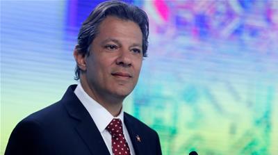 Presidential candidate Haddad has seen more support in recent polls, but it likely won't be enough to win [Nacho Doce/Reuters]