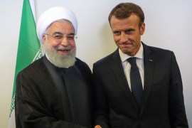 President Emmanuel Macron (R) meets with Iranian President Hassan Rouhani