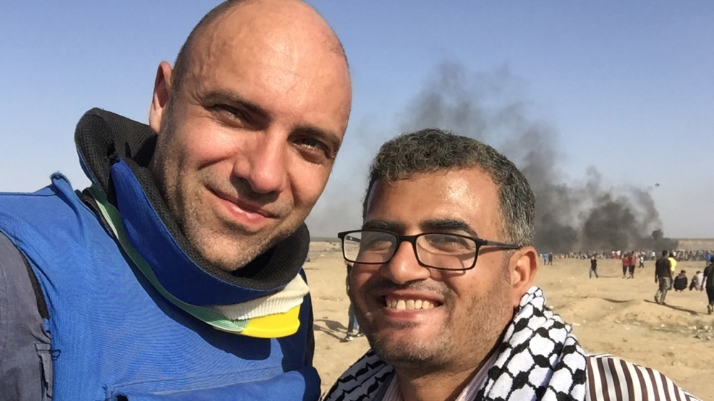 Filmmaker Karim Shah with Ahmed Abu Artema, the Gaza Palestinian poet and one of the lead organisers of the Great March of Return [Al Jazeera]