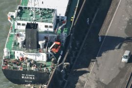 A cargo ship washed ashore by Typhoon Trami is seen in Kawasaki