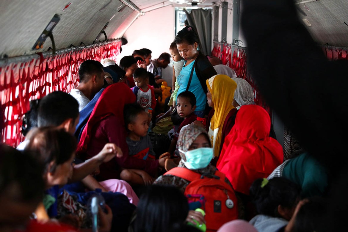 Local residents affected by the earthquake and tsunami are seen on a military aircraft at Mutiara Sis Al Jufri Airport in Palu, Central Sulawesi, Indonesia, October 1, 2018. REUTERS/Athit Perawongmeth