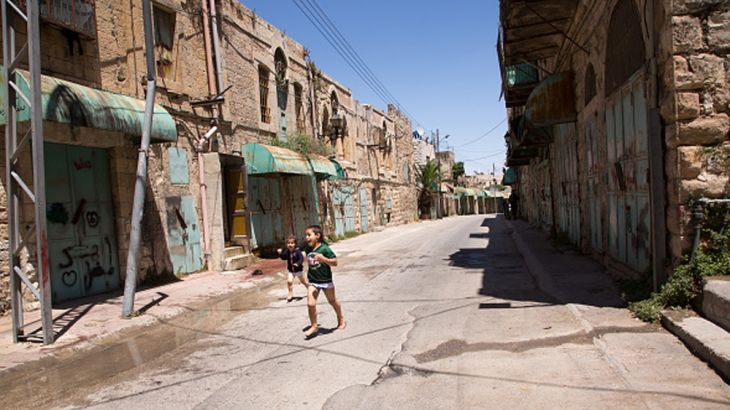 Hebron Daily Life Palestinian children play on an abandoned Shuhada street in the old town of Hebron which is under Israels military control (area H2) on June 14, 2018. Not many Palestinian families