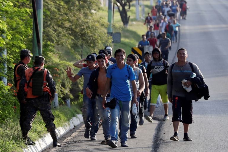 Central American migrants, part of a second wave of migrants heading to the U.S., walk along a highway as they continue their journey to the Mexican border, in Zacapa, Guatemala October 24, 2018.